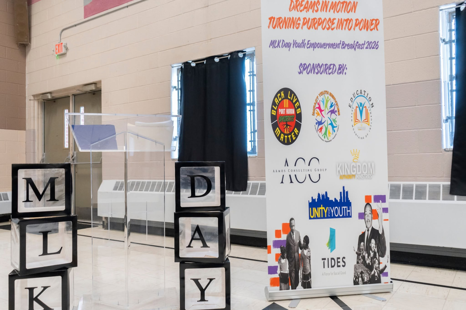 Stage and podium set for a youth empowerment breakfast program